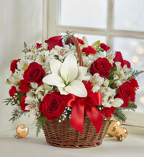 Spread holiday cheer with our basket of blooms. Capturing the natural beauty of flowers picked fresh from the European countryside, this hand-gathered arrangement is designed in Christmas colors, creating a joyful surprise for family & friends. Makes a charming centerpiece for all the celebrations of the season!