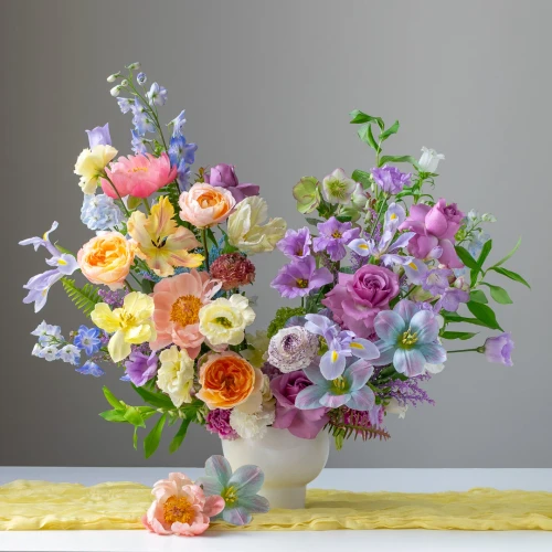 One of our best sellers! This pastel stylized design comes delicately arranged in a clear vase or compote.

**Please note exact flowers will differ from the photo. Our design team will select the freshest pastel blooms to create your order. 