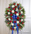 They served their country with honor and pride, which is how they should be remembered. Our patriotic standing spray arrangement is meticulously handcrafted by our expert florists to honor a brave veteran who has passed away. Filled with fresh blooms in red, white and blue for a lush, full presentation, it's a proud and fitting final tribute.