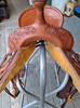 New Stock Saddle by Fort Worth Saddle Co with 14 inch seat. Round skirted lightweight trail saddle with extra rings & snap for hauling gear. Drop rigging on front and high pencil roll cantle for secure ride. Matching billets and flank cinch included. Gullet size is 6.75 inch, weight is 25lbs, and skirt is 23 inch. Made in USA. Limited lifetime warranty.

S995