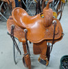 New Stock Saddle in Hermann Oak leather by Fort Worth Saddle Co with 14 inch seat. Round skirted lightweight trail saddle with extra rings & snap for hauling gear. Drop rigging on front and high pencil roll cantle for secure ride. Matching billets and flank cinch included. Gullet size is 6.75 inch, weight is 25lbs, and skirt is 23 inch. Made in USA. Limited lifetime warranty.

S995