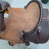 New Stock Saddle in Hermann Oak leather by Fort Worth Saddle Co with 13 inch seat. Dark chocolate coloring. Roughout seat with pencil roll. Tooled skirts. Gullet size is 7.25 inch, weight is 28lbs, and skirt is 24 inch. Made in USA. Limited lifetime warranty.

S1002