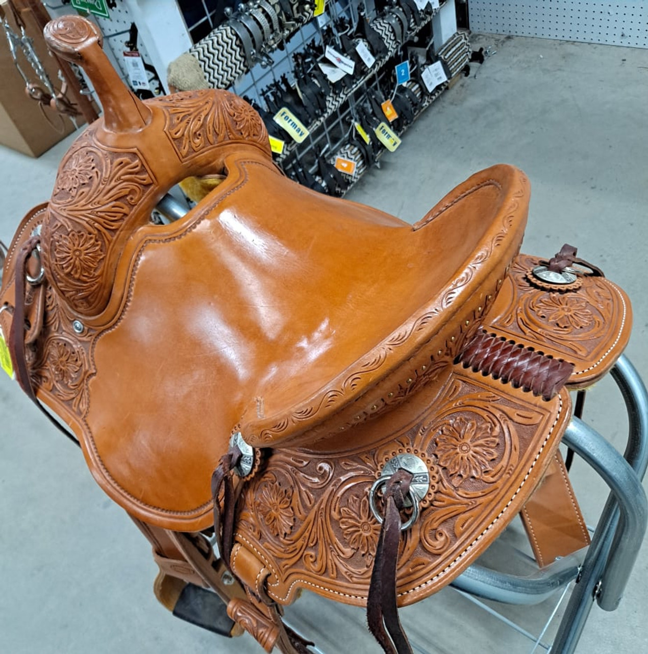 New Stock Saddle in Hermann Oak leather by Fort Worth Saddle Co with 14 inch seat. Round skirted lightweight trail saddle with extra rings & snap for hauling gear. Drop rigging on front and high pencil roll cantle for secure ride. Matching billets and flank cinch included. Gullet size is 6.75 inch, weight is 25lbs, and skirt is 23 inch. Made in USA. Limited lifetime warranty.

S995