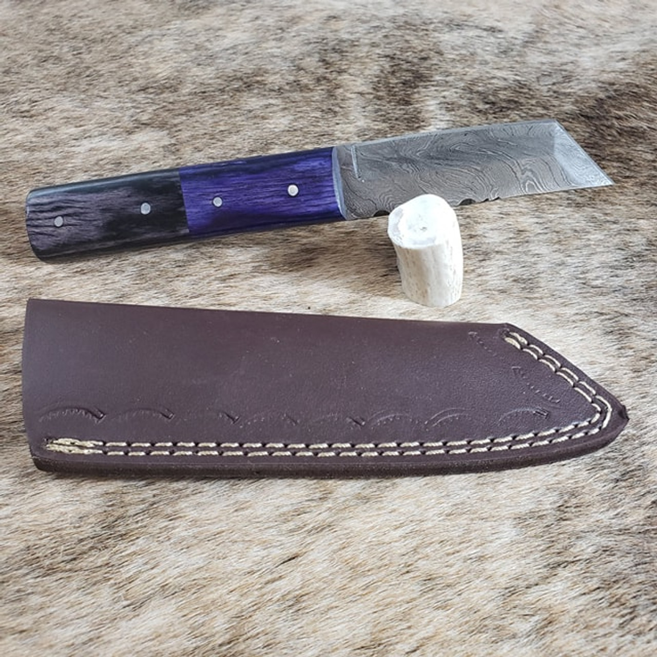 Hunter. Damascus Steel. Total length is 8.5 inches with 4 inch blade. Handle is Synthetic. Vertical sheath included. Straight edge with angled chisel point. Heavy construction.