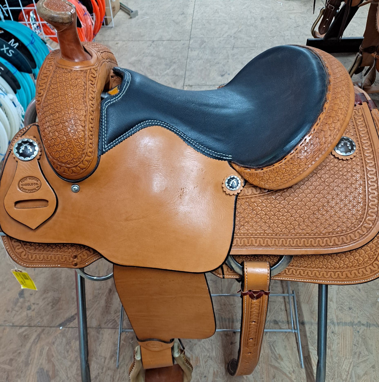 New Roping Saddle by Fort Worth Saddle Co with 14 inch padded leather seat, in-skirt front rigging, slick jockeys and fenders. Hand-tooled pommel, skirts, chasis and cheyenne roll. Gullet size is 6 inch. Made in USA. Limited lifetime warranty.

S624