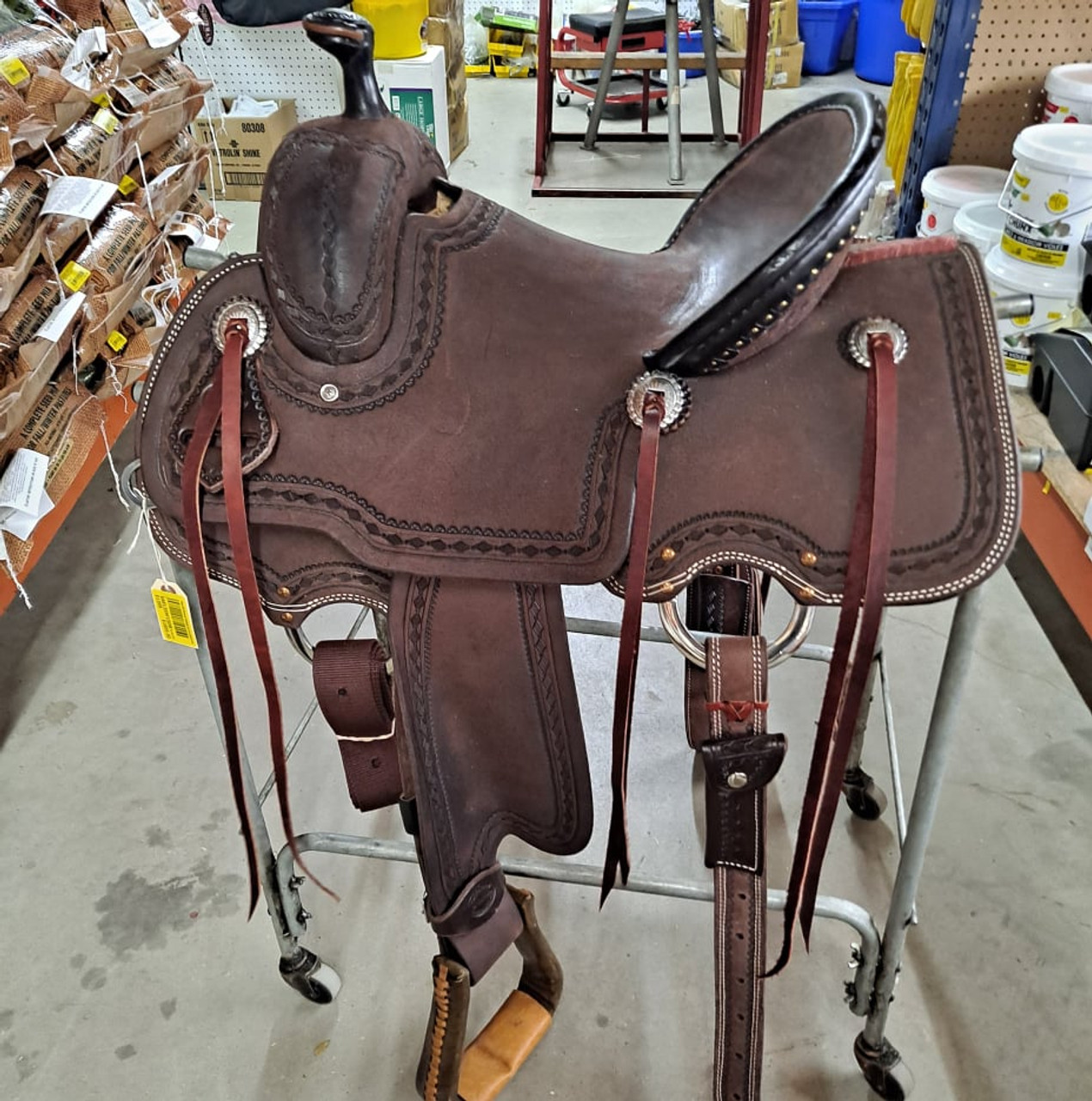 New All Around Saddle by Fort Worth Saddle Co with 13.5 inch seat. Built on our new proprietary Jplus "hog-bars" roping tree, our new all-around saddle is lightweight, but can be roped from. Limited lifetime warranty on tree. Constructed of Hermann Oak leather. Hand tooled. Secure pencil roll seat. Drop-rigged for added stability. Gullet size is 8.25 inch, weight is 35lbs, and skirt is 26 inch. Made in USA. Limited lifetime warranty.

S1399