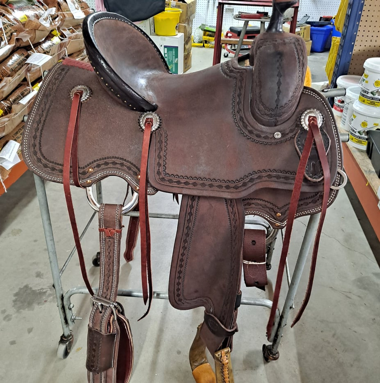 New All Around Saddle by Fort Worth Saddle Co with 13.5 inch seat. Built on our new proprietary Jplus "hog-bars" roping tree, our new all-around saddle is lightweight, but can be roped from. Limited lifetime warranty on tree. Constructed of Hermann Oak leather. Hand tooled. Secure pencil roll seat. Drop-rigged for added stability. Gullet size is 8.25 inch, weight is 35lbs, and skirt is 26 inch. Made in USA. Limited lifetime warranty.

S1399
