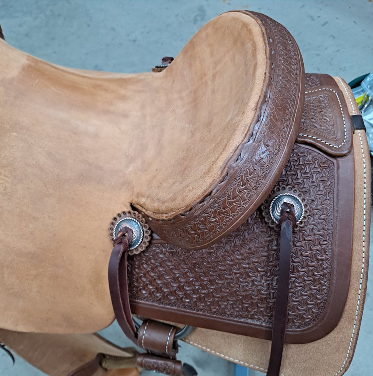 New Ranch Cutter by Fort Worth Saddle Co with 15 inch seat. Hermann Oak leather. Roughout contact points and skirt. Hand tooled rear chassis, cantle, and pommel. Gullet size is 7 inch, weight is 35lbs, and skirt is 27.5 inch. Made in USA. Limited lifetime warranty.

S1485