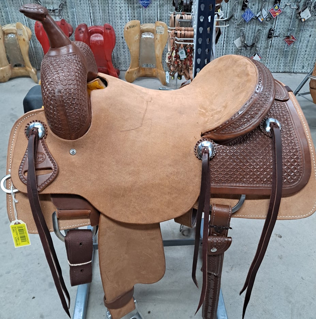 New Cutting Saddle by Fort Worth Saddle Co with 15 inch seat. Hermann Oak leather. Roughout contact points and skirt. Hand tooled rear chassis, cantle, and pommel. Gullet size is 7.25 inch, weight is 36lbs, and skirt is 27.25 inch. Made in USA. Limited lifetime warranty.

S1491