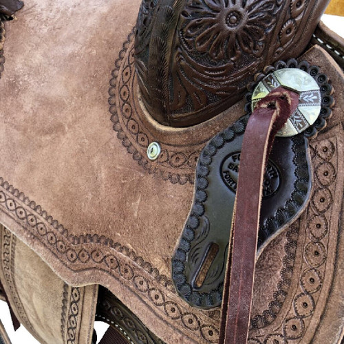 New Jackson Stock Saddle by Fort Worth Saddle Co with 13 inch seat.  Floral hand-tooling on skirt and pommel. Pencil roll with border tooled roughout seat and jockeys. Gullet size is 7.5 inch, weight is 27lbs, and skirt is 25 inch. Made in USA. Limited lifetime warranty.  S993