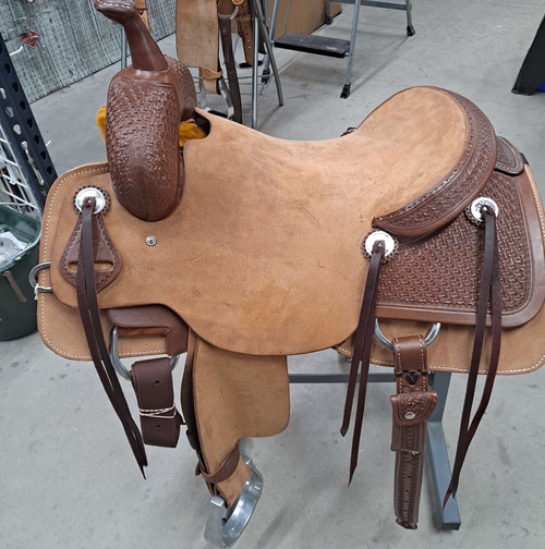 New Cutting Saddle by Fort Worth Saddle Co with 16 inch seat. Hermann Oak leather. Roughout contact points and skirt. Hand tooled rear chassis, cantle, and pommel. Gullet size is 7 inch, weight is 36lbs, and skirt is 28.75 inch. Made in USA. Limited lifetime warranty.

S1487