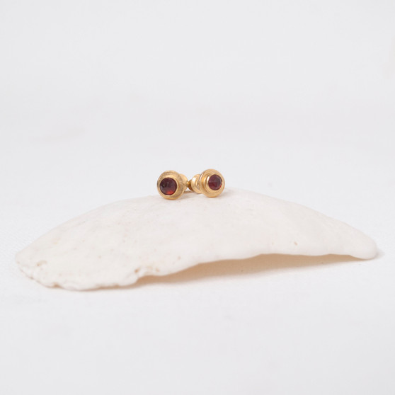 petite gold studs with red garnet