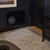 REL Planar PL-2 – 8” Powered Subwoofer on wall installation black living room without grille
