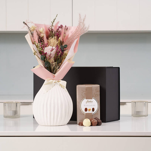 Mother’s Day pink bouquet and chocolates gift set featuring fresh seasonal flowers and premium Irish chocolates—perfect luxury gift for moms, birthdays, or special occasions.