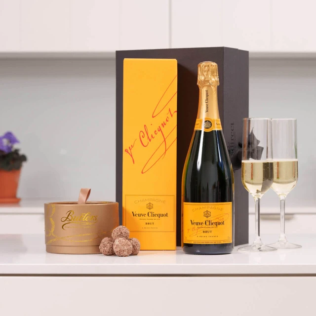 Veuve Clicquot & Butlers Truffles gift set featuring a bottle of premium champagne paired with luxurious Irish chocolate truffles, available at GiftsDirect