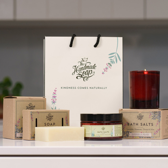 The Handmade Soap Company Gift set featuring artisanal bath salts, soap, candle, and branded gift bag with floral packaging—perfect for self-care and thoughtful gifting.
It highlights the natural aesthetic and product variety while keeping it flexible for use across listings or seasonal promotions. If you’re building a wellness or pampering category, I can help create a cohesive alt text style for the whole range.