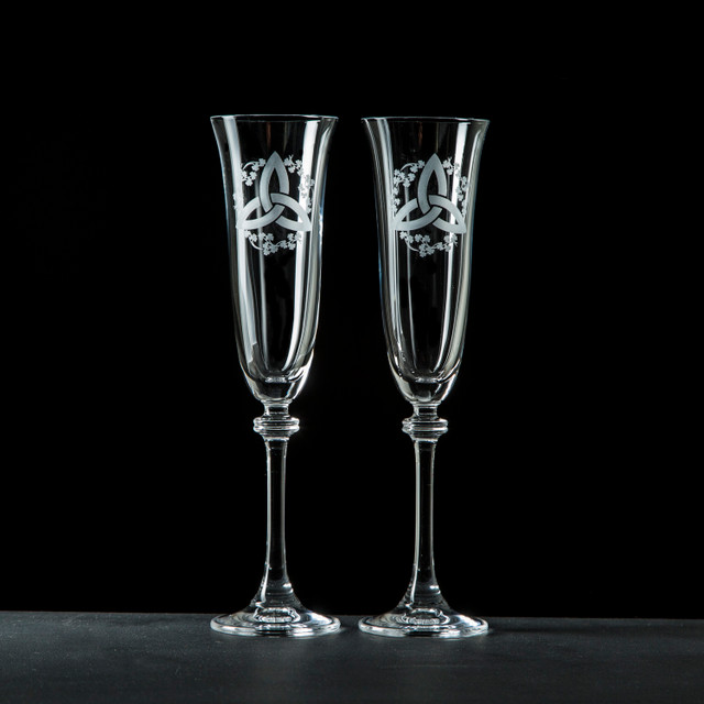 Pair of personalised Galway Crystal Liberty champagne flutes with etched Trinity Knot and Shamrock design — elegant Irish wedding or anniversary gift.