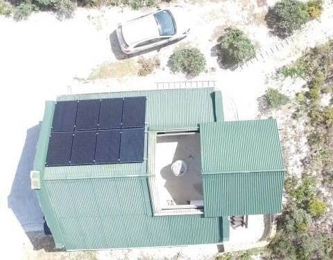 Off-grid - solar panels on garage roof.