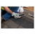 Underside butyl strips of the Guardian 00500 Ridge-It anchor pressed to the roof for a watertight seal