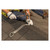 Installer nailing a Guardian 00510 Ridge-It anchor to the roof ridge with the provided spiral nails