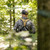Malta Hunting CORE Tree Stand Harness Kit - hunter walking into the woods wearing the harness, back view