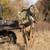 Malta Hunting Hunter's Elite Hunt Essentials Pack - hunter wearing the Hunter's Elite harness beside a UTV