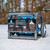 Tie Down BigFoot Non-Penetrating Fall Protection Cart, 3 Workers, SKU 60060US, Tie Down BigFoot cart set on a commercial roof with a worker tied off