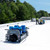 Tie Down Squatch Non-Penetrating Fall Protection Cart, 4 Workers, SKU 61010, Tie Down Squatch cart being rolled into position on flat-free tires