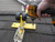 Using a drill to secure a Ridge Pro anchor to a shingle roof.