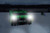 Frontline CMT04-SLR Commando Tank at dusk with both 4,000 lumen headlights illuminating a rooftop work area