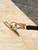 Frontline ROB01 bull ring roof anchor held against roof decking during installation