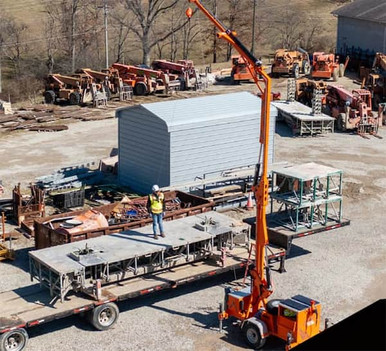 Malta X1250 Mobile Grabber: 34 ft Road-Towable Overhead Anchor for 3 Workers Malta X1250 mobile grabber deployed on a jobsite providing overhead anchor points for up to three workers