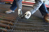 92743BP_ - 92743BPL - 87048 - Worker wearing cut resistant work gloves working around sharp objects with reinforced thumb crotch, touchscreen compatible