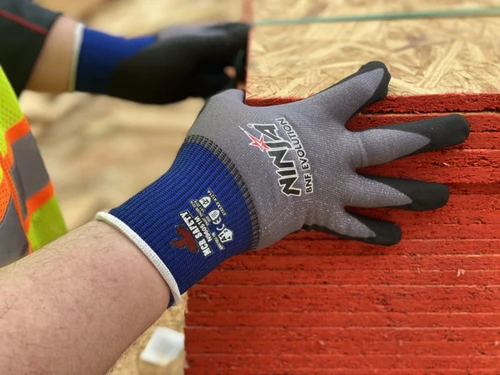 N96051_ - N96051L - 161831 - Image of worker wearing N96051 gray work gloves with black palm while moving plywood