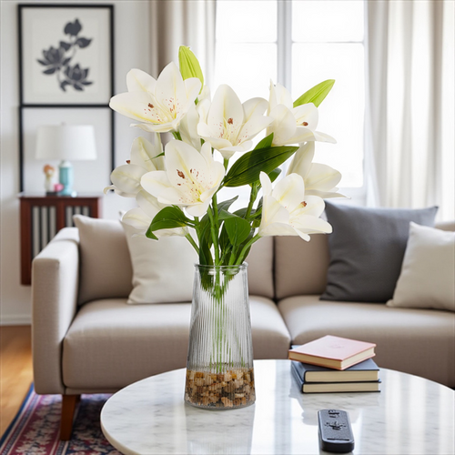 Real touch artificial tiger lily arrangement in a clear glass vase with faux water, shown as an elegant table centerpiece against a neutral background.