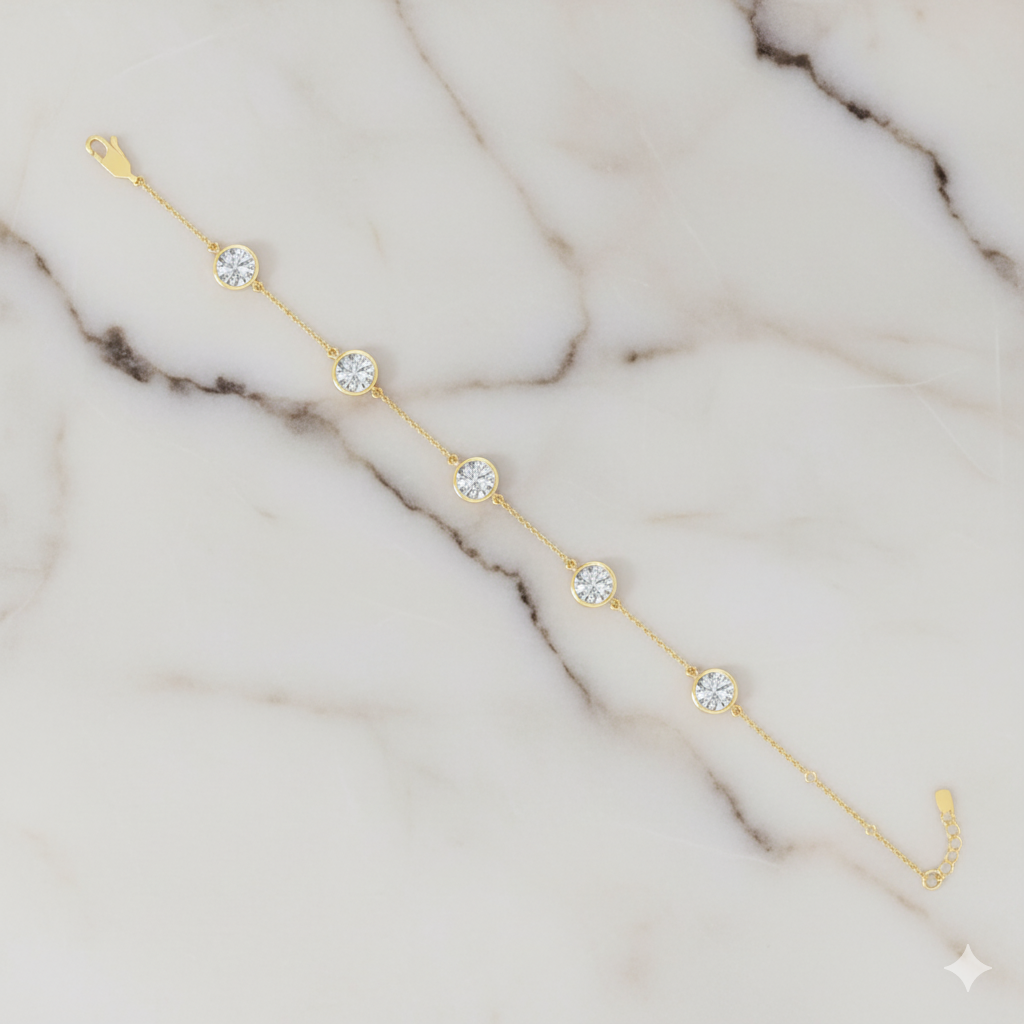A close-up side view of a 14K yellow gold bracelet, showing a series of bezel-set diamonds connected by a delicate chain.
