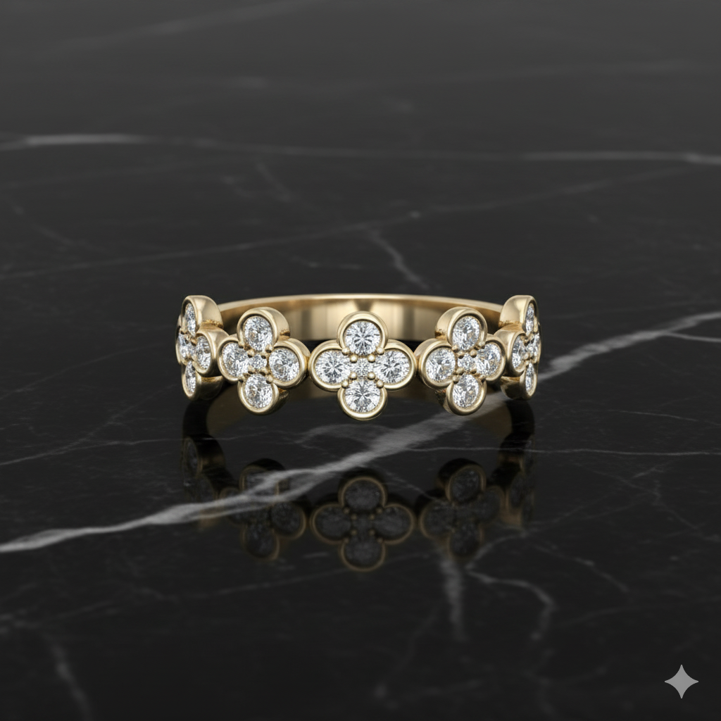 Yellow gold diamond band resting on black marble, featuring repeating floral-inspired clusters of round brilliant-cut diamonds set in polished gold for a refined, elegant look.