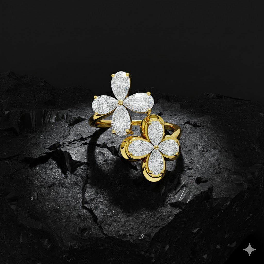 Yellow gold floral diamond ring with marquise-cut white diamonds resting on a textured dark rock, highlighting the organic flower silhouette, white diamond brilliance, and contrast between polished gold and rugged stone.