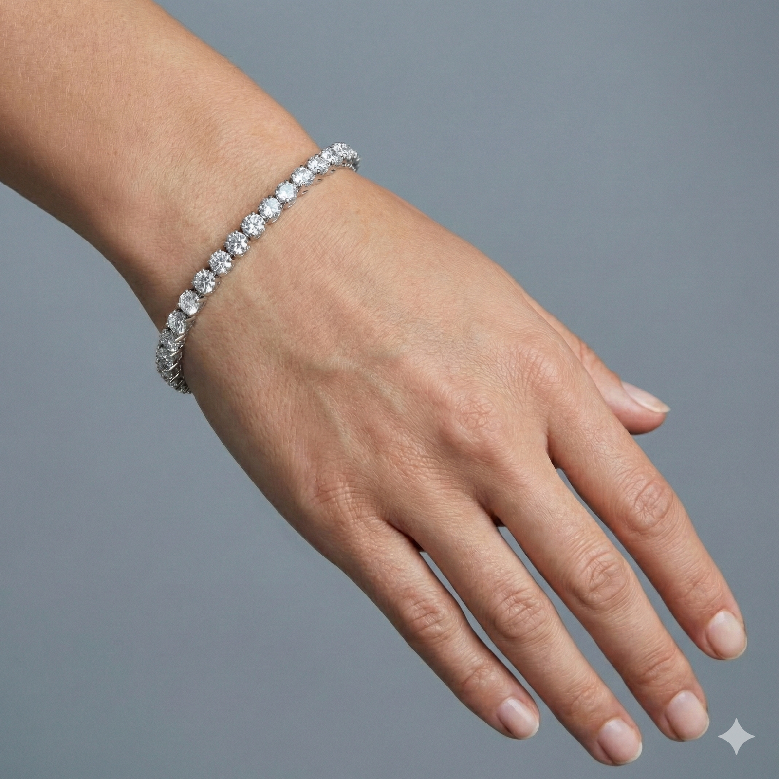 Clasped view of the ultimate luxury 14K white gold tennis chain (Evermore Bracelet) on a wrist.