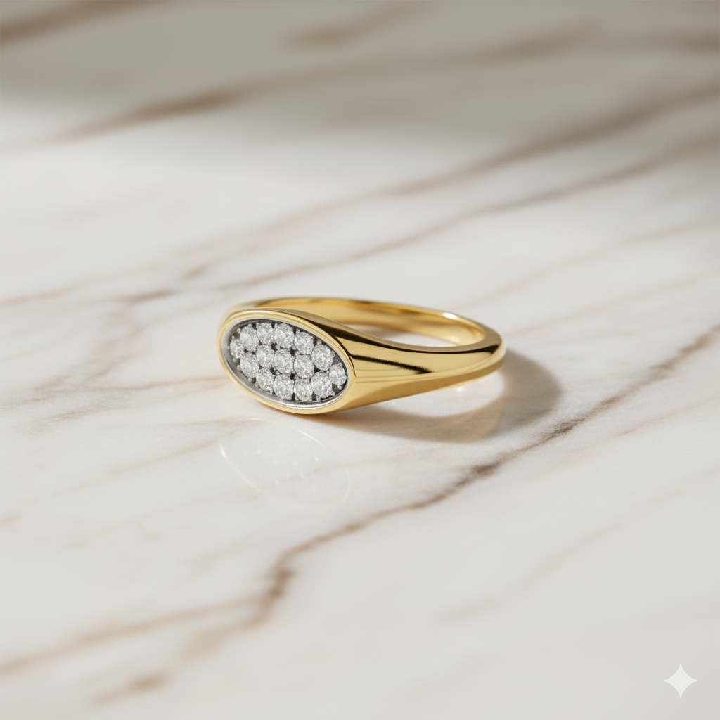 Photoshoot view of a 14K yellow gold oval signet ring with a continuous line of pavé diamonds.