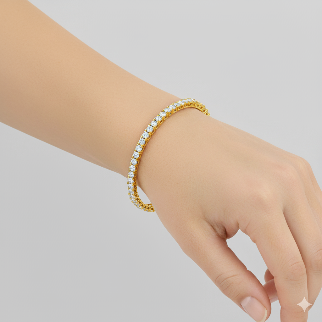 A view of the 14K yellow gold tennis bracelet, coiled to show the continuous, brilliant line of diamonds on a wrist.