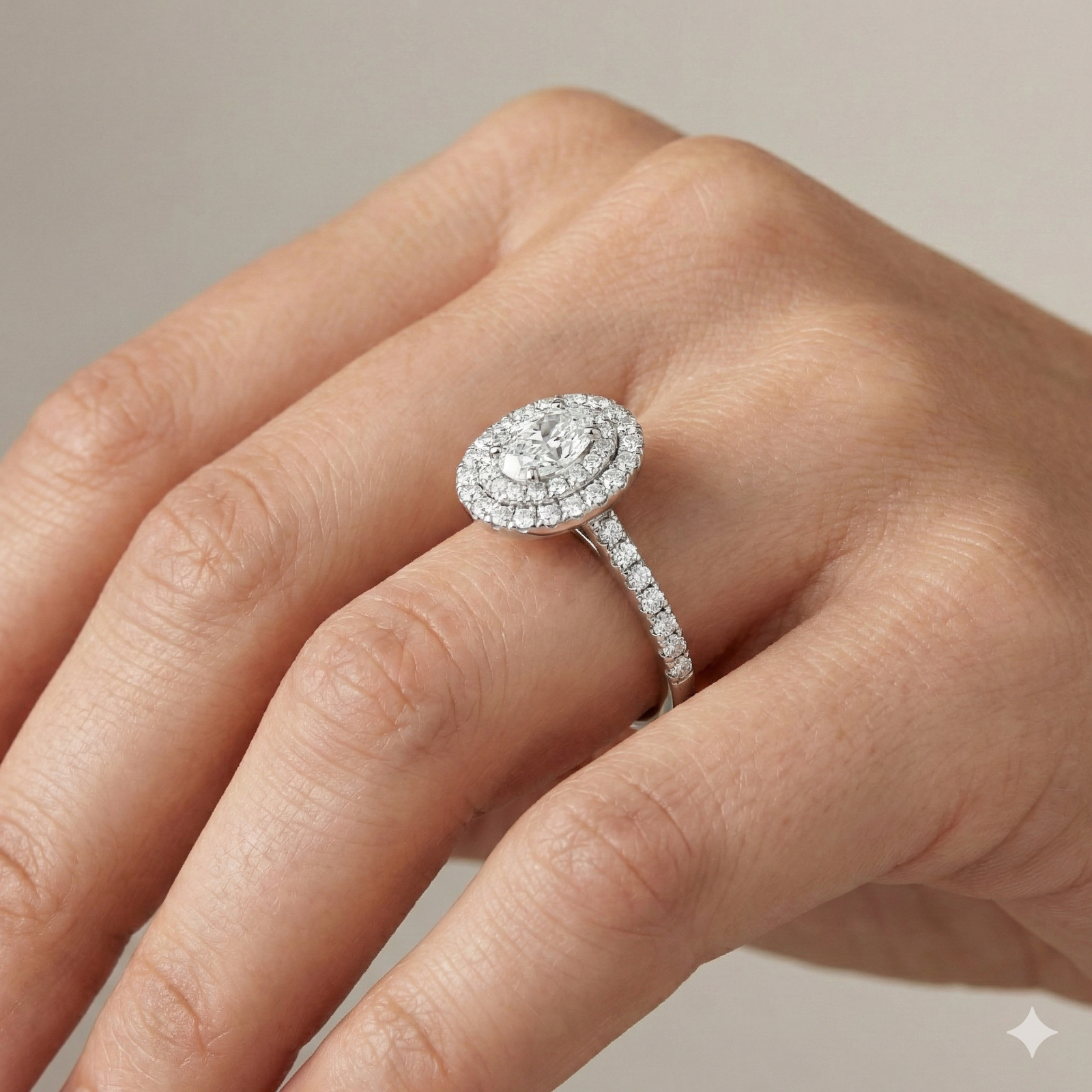 Elongated cushion cut diamond engagement ring in 14k white gold with a diamond channel band and cathedral setting on a hand