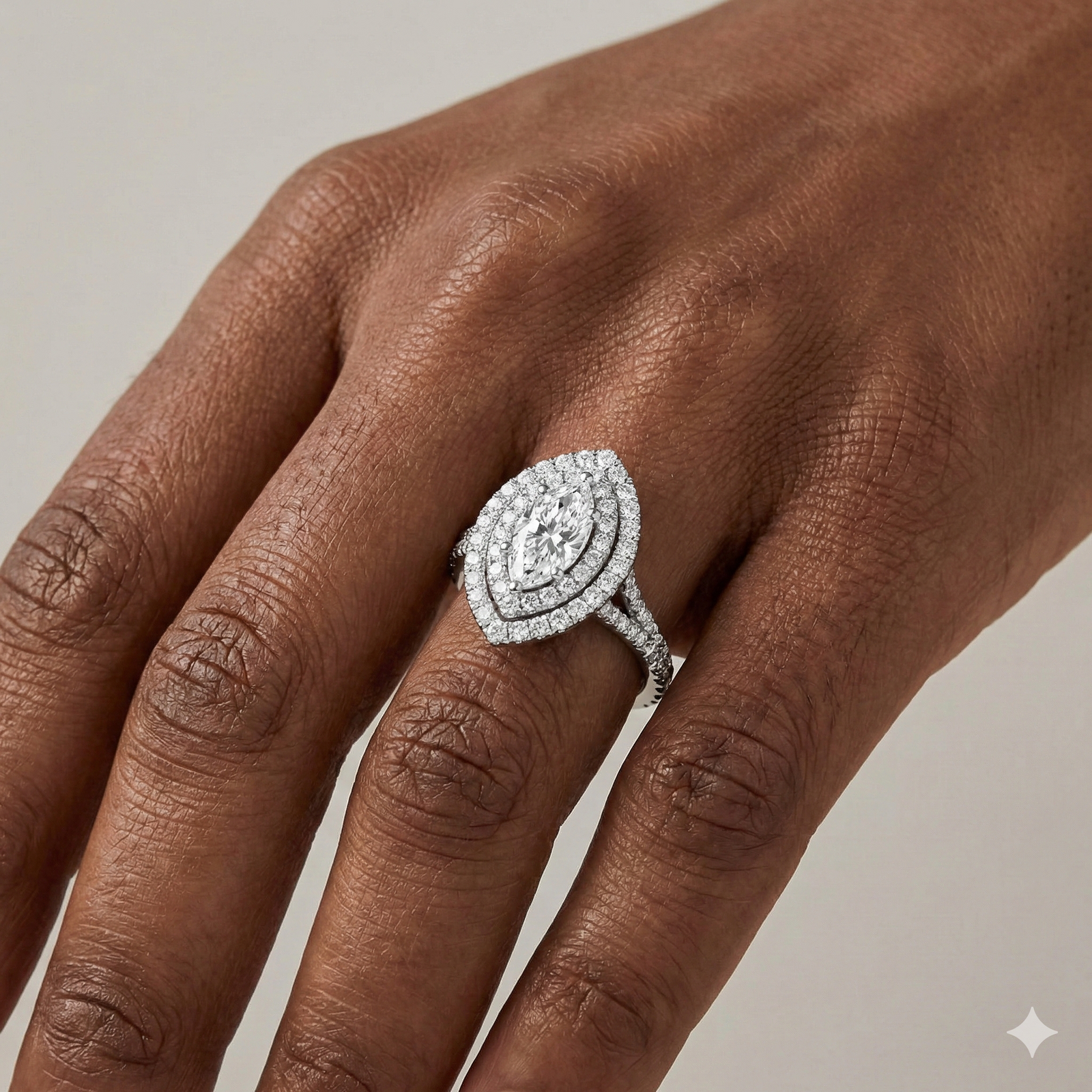 Marquise cut diamond engagement ring in 14k white gold with a prong diamond band and split setting on a hand