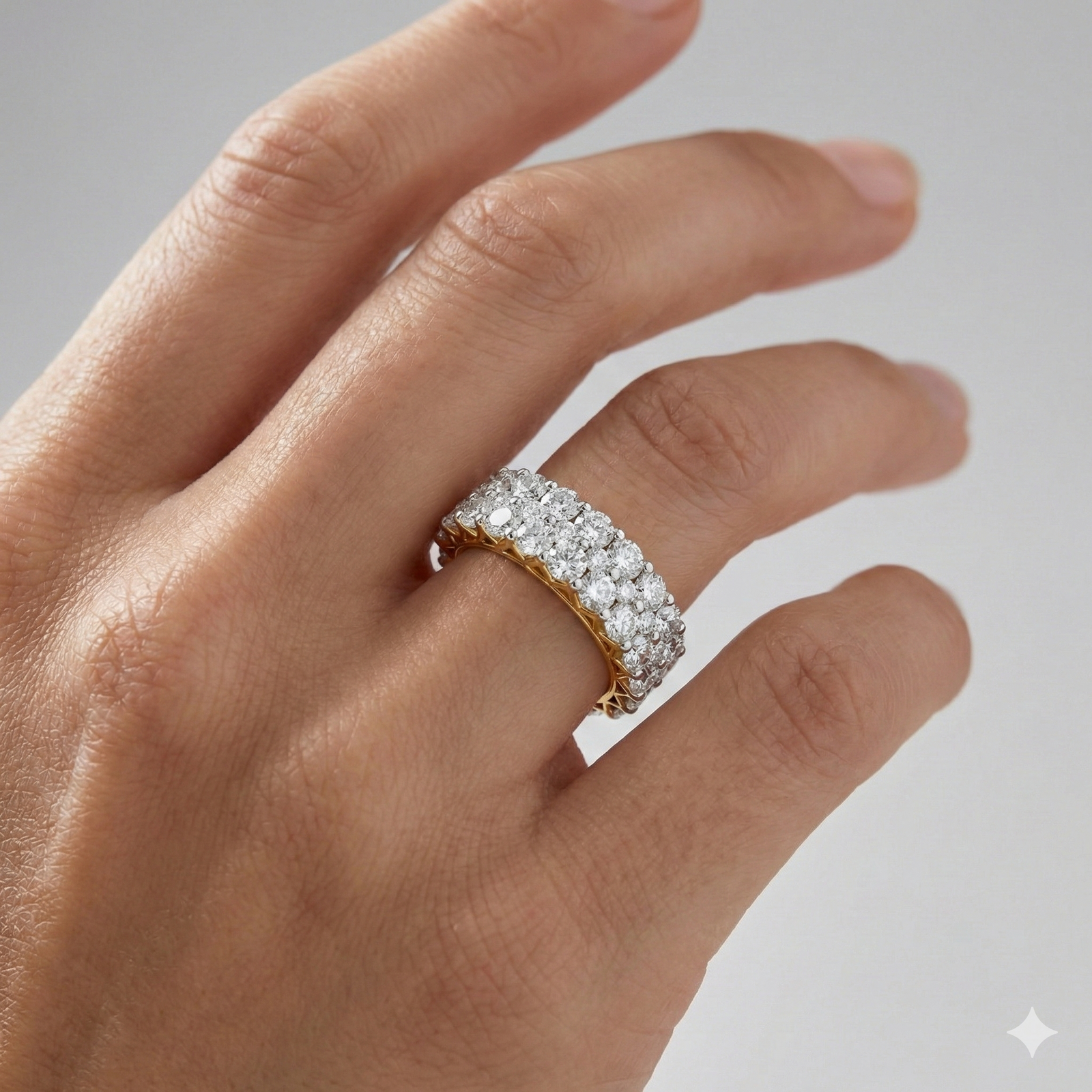 A breathtaking 14k yellow gold full eternity band featuring two rows of shimmering round-cut lab-grown diamonds totaling 3.0 carats on hand.