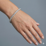 Clasped view of the ultimate luxury 14K white gold tennis chain (Evermore Bracelet) on a wrist.