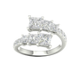 A top-down view of a 14K white gold ring with an asymmetrical cluster of princess-cut and baguette diamonds.