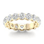 A top-down view of a 14K yellow gold eternity band with a continuous line of large, brilliant oval jewels.