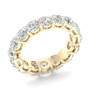 An angled view of a 14K yellow gold eternity band, highlighting the intense sparkle of the oval jewels.