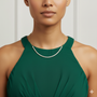 A full view profile of the 14K white gold lab grown diamond tennis necklace, showcasing its continuous line of diamonds on a model.