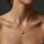 Yellow gold round diamond cluster necklace worn on figure, offering a warm glow and timeless silhouette suitable for everyday wear.